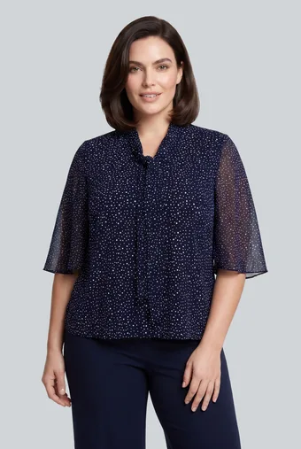 Camicetta blu navy a pois bianchi e laccetti